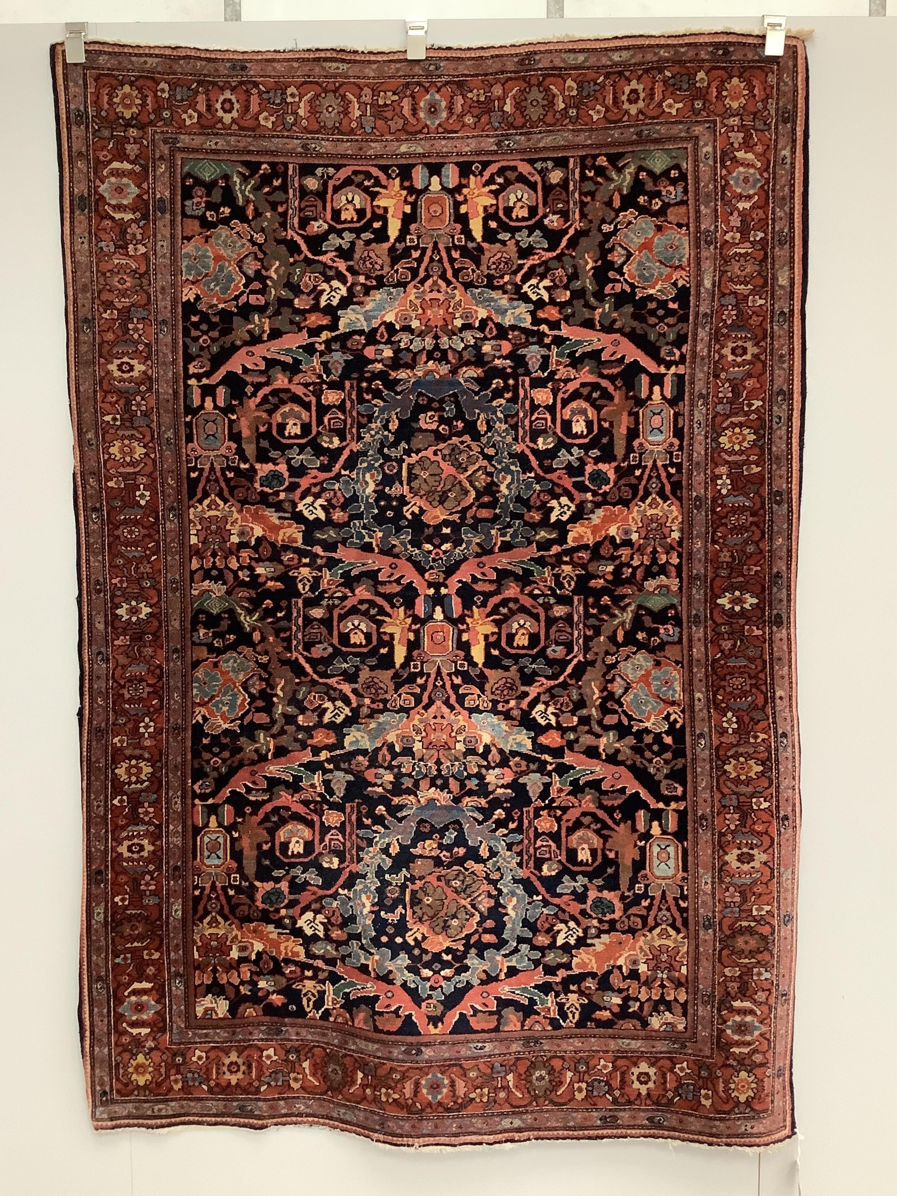 A Kashan dark blue ground rug, 200 x 138cm